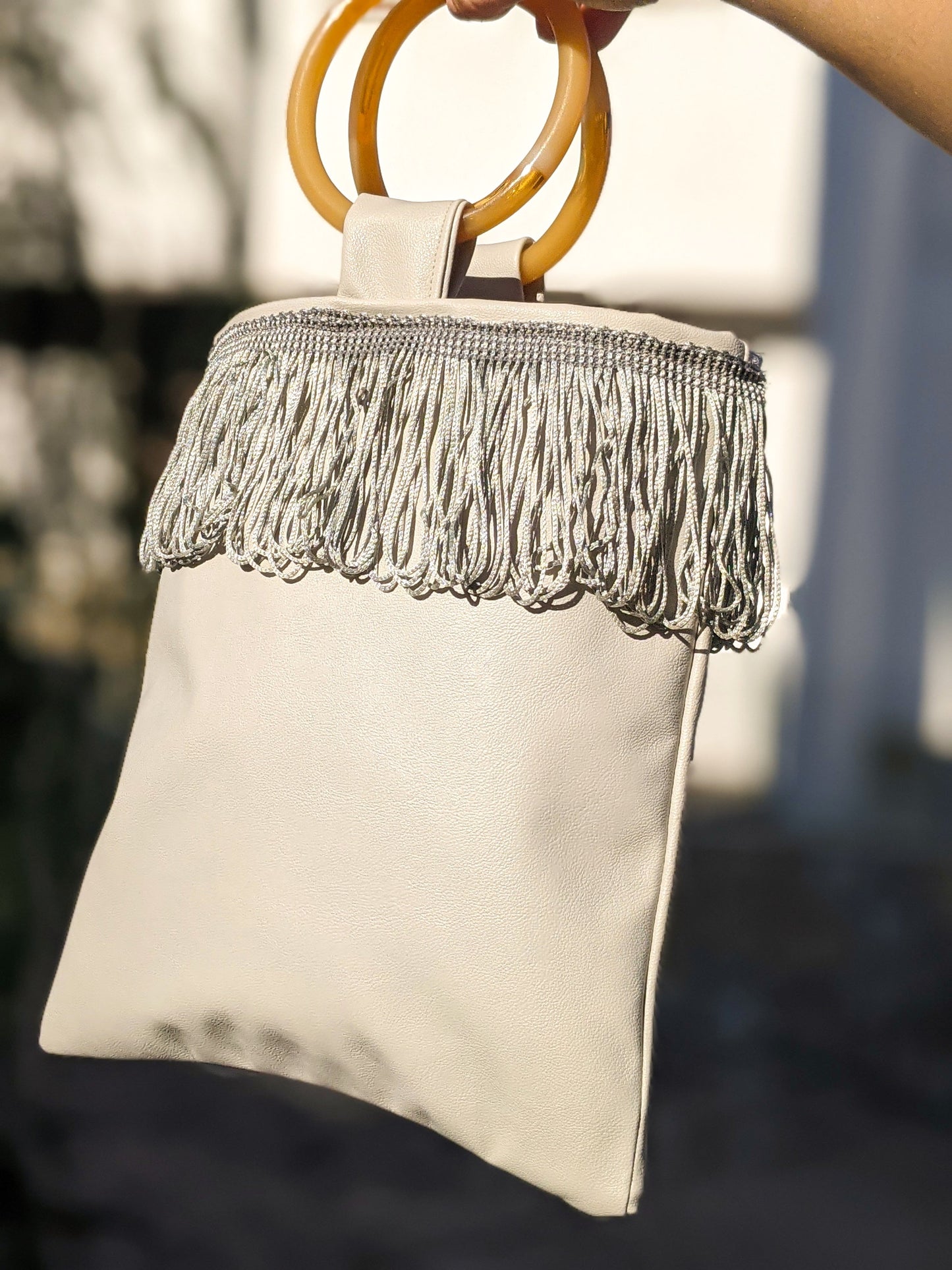 Light Grey Mini Faux Leather Bag with Amber Resin Handles and Fringe Detailing